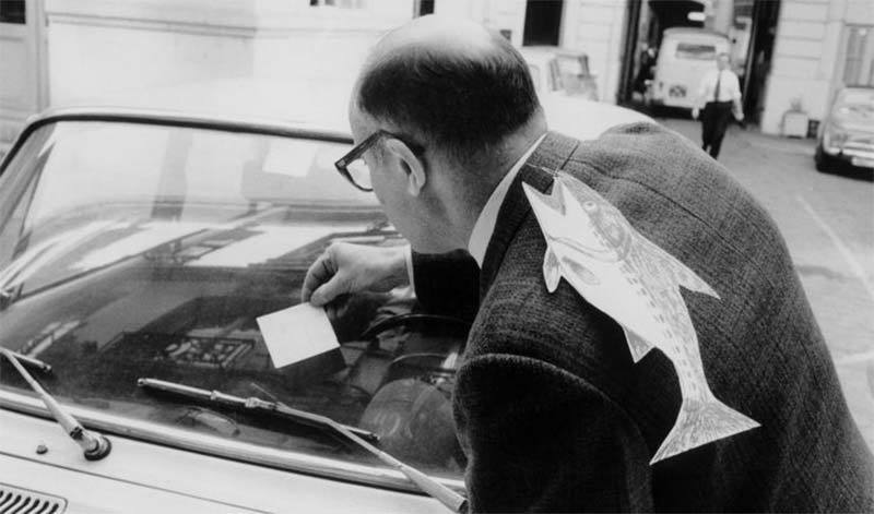 photo of man with a poisson d'avril on his back in Paris 1972