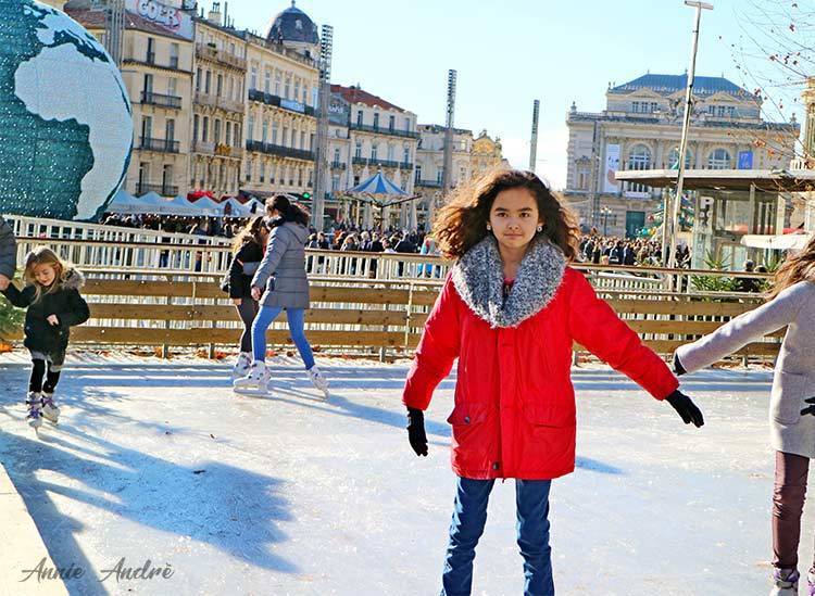 ice skating in Montpellier during Christmas market ice skating in Montpellier during Christmas with place de la comédie in background