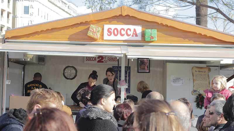 Socca is a Chickpea flour from Nice that is popular at Christmas markets in South Eastern France Photo of Socca Chalet in Nice France