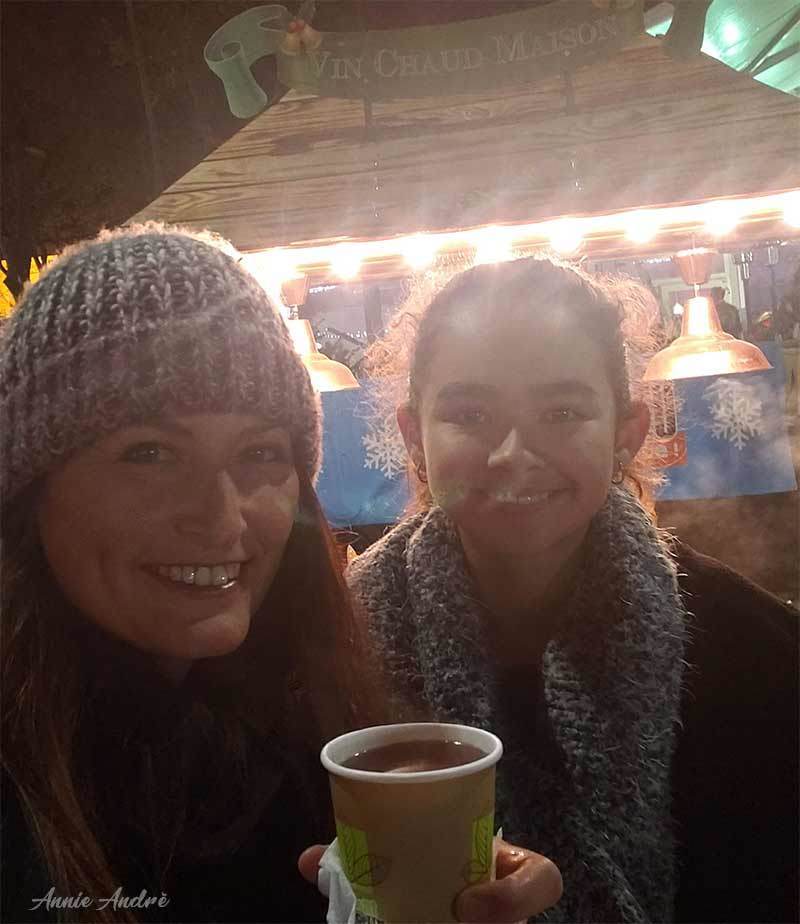 photo drinking vin chaud (mulled wine) at a French Christmas market in France